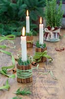 Centrepiece of festive cinnamon candle holders.