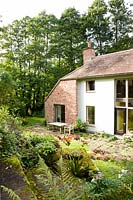 House converted from derelict corn mill with terrace, Aston Crews, Herefordshire, UK.