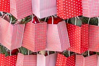 Paper bags filled with festive gifts