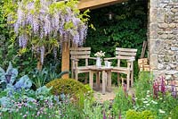 Cottage garden with flowering Wisteria and vegetable plot. Welcome to Yorkshire garden, Sponsor: Welcome to Yorkshire, RHS Chelsea Flower Show, 2018.