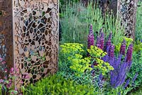 Lupinus, Salvia and Euphorbia with laser cut metal grids. Urban Flow garden, RHS Chelsea Flower Show, 2018. Sponsor: Thames Water.