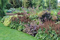 Border planted with moisture loving plants in the Wells Gardens including hostas,
 astilbes, heucheras and rodgersias