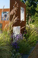 COR-TEN steel screens with Pennisetum orientale 'Shogun' and Lavendula angustifolia 'Hidcote. 'RNIB Community Garden', RHS Hampton Flower Show 2018.
