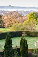 Views across formal garden features such as lawns and clipped hedging to the surrounding 
countryside 
