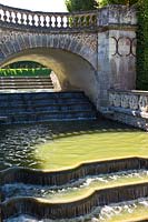 An ornamental waterfall flowing from The Water Garden at Chateau de Villandry, Loire Valley, France. 