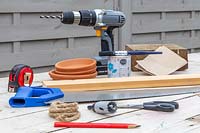 Tools for making hanging bird table feeder.