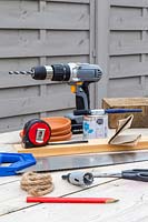 Tools for making hanging bird table feeder.