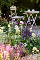 Summer border with soft pastel flowers. Best of Both Worlds garden, Sponsored by BALI, RHS Hampton Court Palace Flower Show, 2018. 