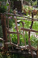 Driftwood fence. 'Postcard From Wales' Garden, RHS Chelsea Flower Show.
