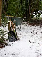 Tools and equipment for snow clearing in garden. 