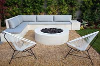 Built-in concrete seating area and fire feature in Californian garden. Designed by Falling Waters Landscape, inc Ryan Prange, New Port Beach, California, USA.