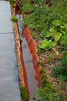 Drainage channel in The Inspire and Achieve Foundation Garden: The Good Within
