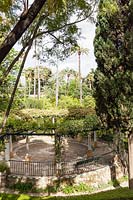 Circular pergola in Jardin Marques de la Vega Inclan. View from the Galera del Grutesco. Alcazar Palace Gardens, Seville, Spain. 