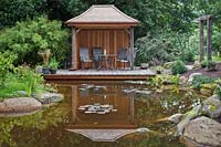 View across the pond to the Japanese teahouse and deck.