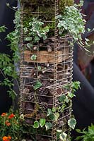 Insect hotel made in metal gabion. 