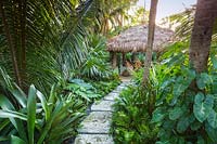 The chickee hut in tropical garden. The Jones Residence, Key West, Florida, USA. Garden design by Craig Reynolds.
