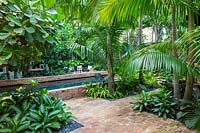 Swimming pool in tropical garden. Key West Classic Garden, designed by Craig Reynolds. Key West, Florida, USA.