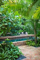 Swimming pool in tropical garden. Key West Classic Garden, designed by Craig Reynolds. Key West, Florida, USA.