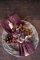 Overhead view of burgundy dried Hydrangea place setting