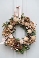 Natural wreath with dried Hydrangea flowers 
and other foraged items such as: seedheads, Pussy Willow, mistletoe, Fir and 
feathers