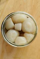Beta vulgaris 'Albina Vereduna' - White beetroot 'Albina Vereduna' - cooked and chopped up roots in a jar for pickling. 