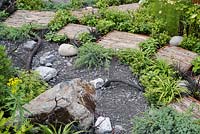 Rough stepping stones in the Through Your Eyes garden, designed by Lawerence Roberts and William Roobrouck, sponsored by Kebony, CED Stone Group, RandG Metal Products at RHS Hampton Court Garden Festival, 2019.