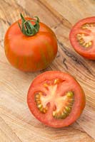 Harvested Tomato 'Tigerella' on chopping board