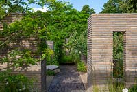 Brick path leading through garden rooms with Belgian brick paver partitions - The RHS Sanctuary Garden, RHS Hampton Court Palace Flower Festival 2019