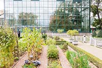 View over the Herb Garden to the Glasshouse in September.