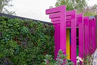 Pink walkway through to classroom with a living wall - The Montessori Centenary Children's Garden, RHS Chelsea Flower Show 2019