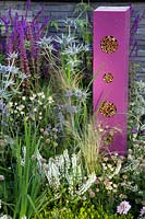 Towering pink insect hotels in the Contemporary Bee and Butterfly Garden at BBC Gardener's World Live 2017