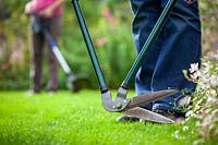 Alternative lawn edging equipment options - mechanical long handled edging shears or electric edge trimmer
