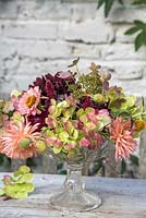 Autumn floral arrangement with Dahlias, Zinnias and Hydrangea in glass bowl