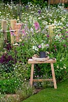 Stool with a vase display of cut flowers - Springwatch Garden - Hampton Court Flower Show 2019 