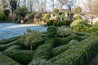 Knot garden, view along diagonal, with lawn, topiary beds beyond