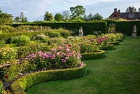 View of rose beds edged with serpentine Buxus - Box - edging in The Renaissance Garden 