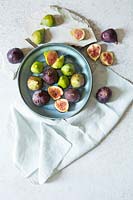 Whole and halved figs in a bowl