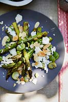 Roasted asparagus with braodbeans, cheese and nuts 