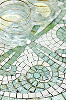 Mosaic table surface with white and green mosaics