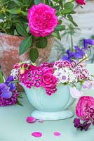 Dianthus barbartus - Sweet williams, roses and sweet peas in vintage blue vase
