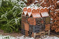 Insect house in Winter with dusting of snow