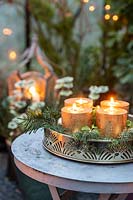 Gold tray with candles on small side table