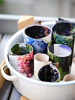 Handmade paper pots in an enamel container