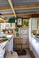 Old fashioned vintage kitchen area for vegetable preparation in garden room