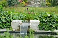 Water feature and pond in garden. 