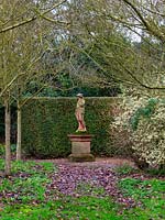 Statue in woodland - East Ruston Old Vicarage Gardens, Norfolk 