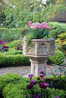 Stone urn in Cotswold Manor House Garden. 