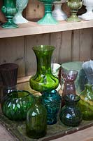 Collection of glass vases and urns in the flower arranging studio. 