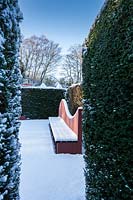 Snow-covered seat in the Reflecting Pool. Garden â€“ Veddw