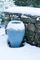 Snow-rimmed blue painted pot in the ruin.  Veddw House Garden